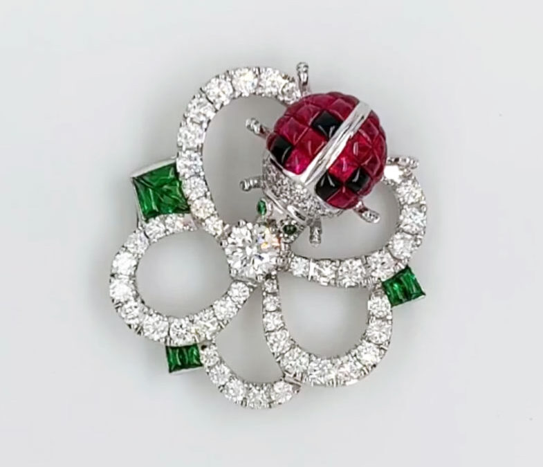 Ladybug pendant in 18K gold set with diamonds, rubies, sapphires and tsavorites